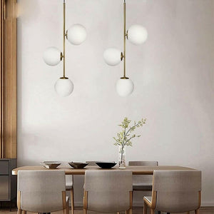 Althar - 3/2 Light White Glass Ball Pendant Light in White Glass and Gold Brass