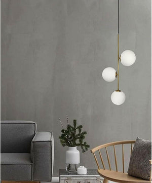 Althar - 3/2 Light White Glass Ball Pendant Light in White Glass and Gold Brass